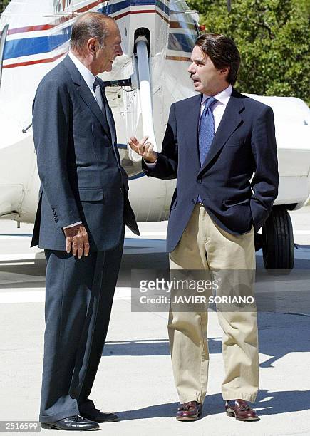 Spanish Prime Minister Jose Maria Aznar confers with French President Jacques Chirac before a meeting at Quintos de Mora in Toledo, at south of...