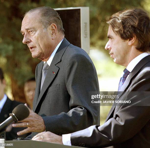 French President Jacques Chirac answers journalists' questions during a joint press conference with Spanish Prime Minister Jose Maria Aznar after...