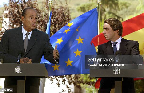 French President Jacques Chirac answers journalists' questions during a joint press conference with Spanish Prime Minister Jose Maria Aznar after...