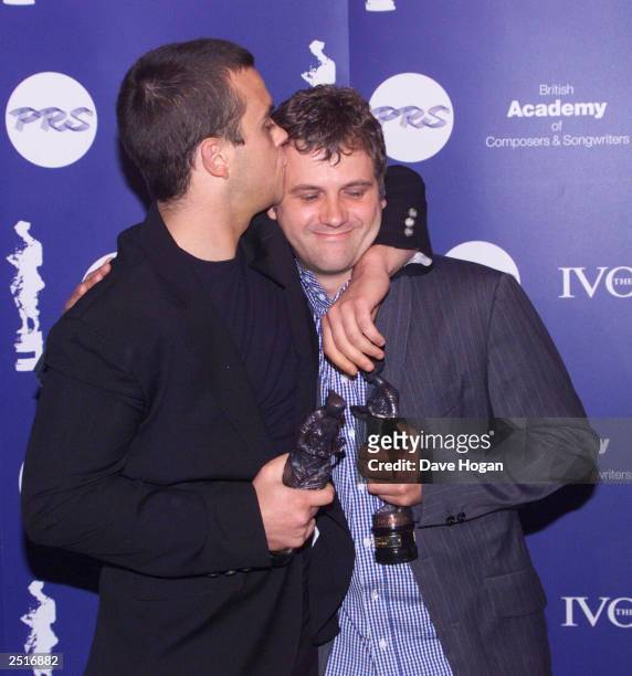 British pop star Robbie Williams and song writing partner at the Ivor Novello Awards at the Grosvenor House Hotel on May 27, 1999 in London.