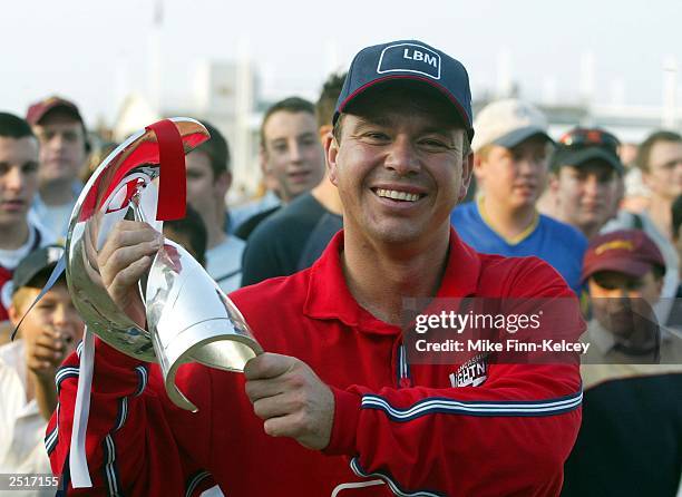 Warren Hegg of Lancashire Lightning poses with the trophy after his team's victory after the National Cricket League Division Two match between...