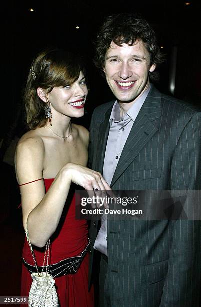 Ukrainian model Milla Jovovich and boyfriend director Paul Anderson arrive at the "Resident Evil" film premiere party at Warner Brothers Cinema, West...