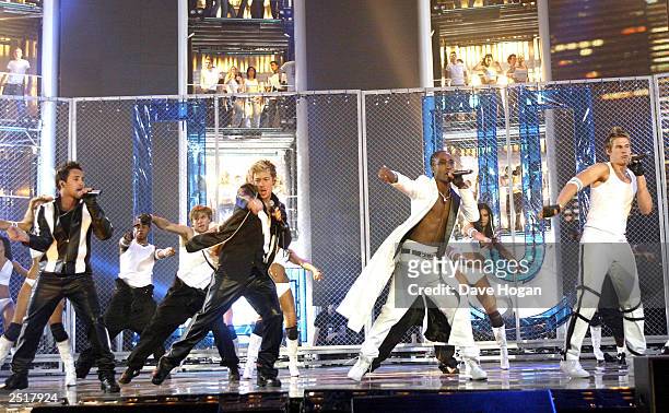 British pop stars Antony Costa , Duncan James , Simon Webbe and Lee Ryan of the boy band "Blue" perform on stage at the 2003 Brit Awards Show at...