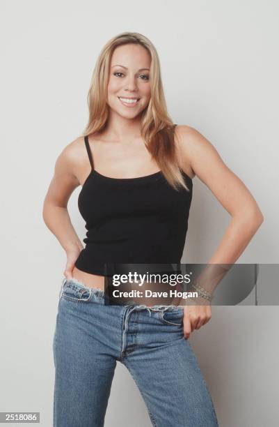 American singer Mariah Carey poses for photos during a promotional photoshoot at the Lanesborough Hotel on October 4, 1999 in London.