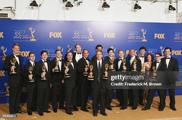 Cast and crew winners for "Outstanding Writting for a Variety Program", in "The Daily Show With Jon Stewart" pose backstage during the 55th Annual...