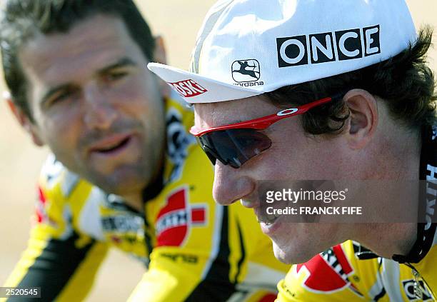 Spain's Isidro Nozal of team Once , current leader of the race, chats with teammate Abraham Olano during a training session during a rest day of the...