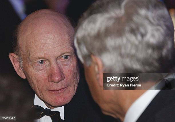 Kevin Bartlett talks to Graham 'Polly' Farmer during the AFL Brownlow Medal Count held at Crown Casino on September 22, 2003 in Melbourne, Australia.