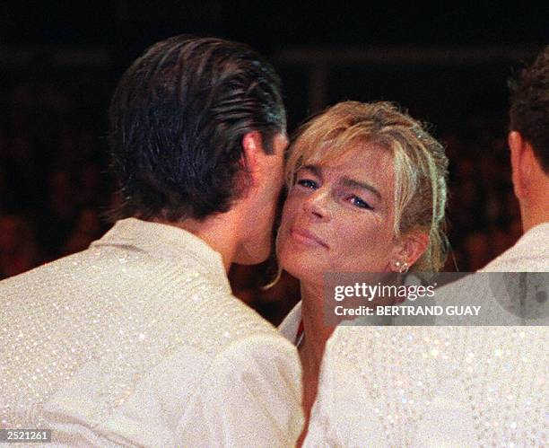 Princesse Stephanie of Monaco kisses Adans Lopez Peres while awarding him and his brother, the circus acrobats called "The Peres Brothers" from...