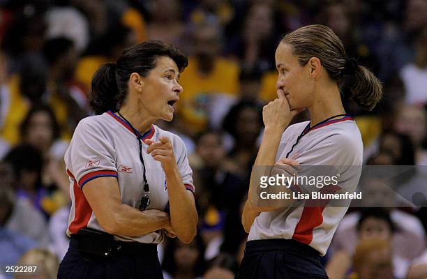 June Courteau and Lisa Mattingly talk during a break from action between the Los Angeles Sparks and the Detroit Shock in Game one the 2003 WNBA...