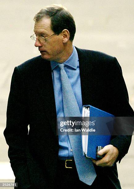 Downing Street spokesman Tom Kelly arrives at the high court to be cross examined at the Hutton inquiry on September 23, 2003 in London. The inquiry...