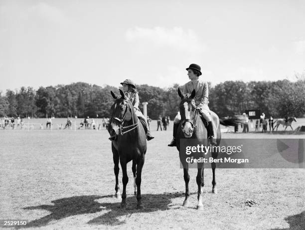 Jacqueline Bouvier and her mother Janet Norton Lee Bouvier ride horseback in the parent-child class of the Smithtown Horse Show, Smithtown, New York,...