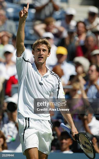 Juan Carlos Ferrero of Spain acknowledges the crowd after a spectacular series of shots against Andre Agassi during the US Open men's singles...