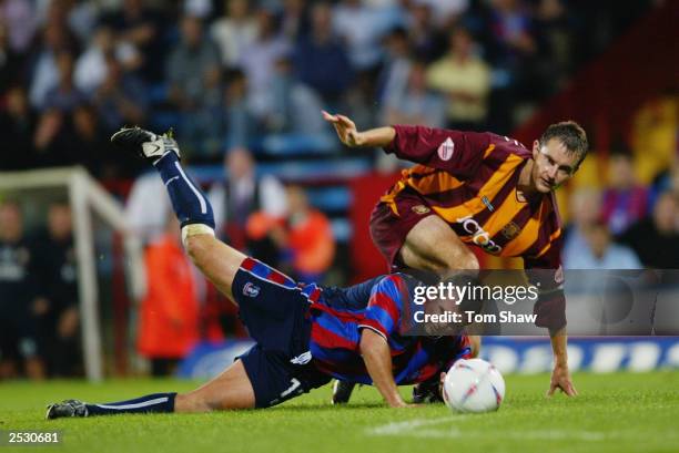Neil Shipperley of Crystal Palace is brought down by David Wetherall of Bradford City during the Nationwide League Division One match held on...