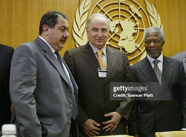 Ahmed Chalabi president of Iraq 's Governing Council, stands with Secretary-General Kofi Annan after a meeting and an other Iraqi delegate September...