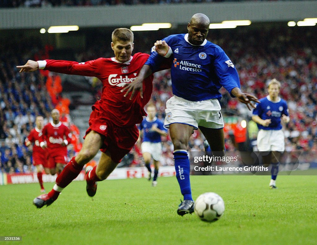 Frank Sinclair of Leicester City holds off Steven Gerrard of Liverpool