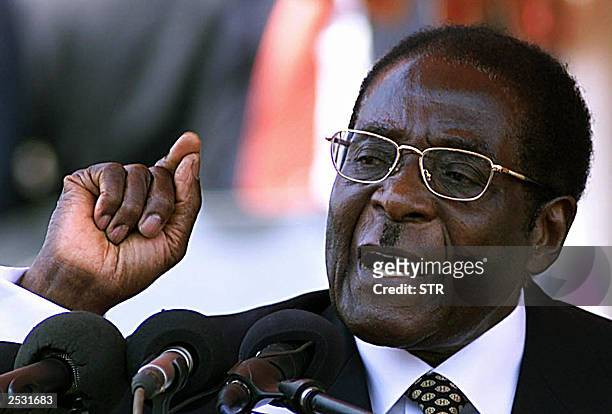 Zimbabwe's President Robert Mugabe, makes a speech at the funeral of his late vice president Vengesayi Muzeda 24 September 2003 in Harare. Mugabe...