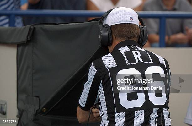 Referee Bernie Kukar reviews a play during the game between the Jacksonville Jaguars and the Indianapolis Colts at the RCA Dome on September 21, 2003...