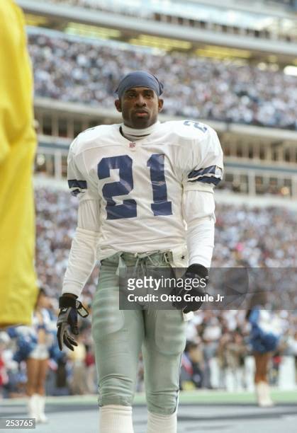 Defensive back Deion Sanders of the Dallas Cowboys looks on during a playoff game against the Green Bay Packers at Texas Stadium in Irving, Texas....