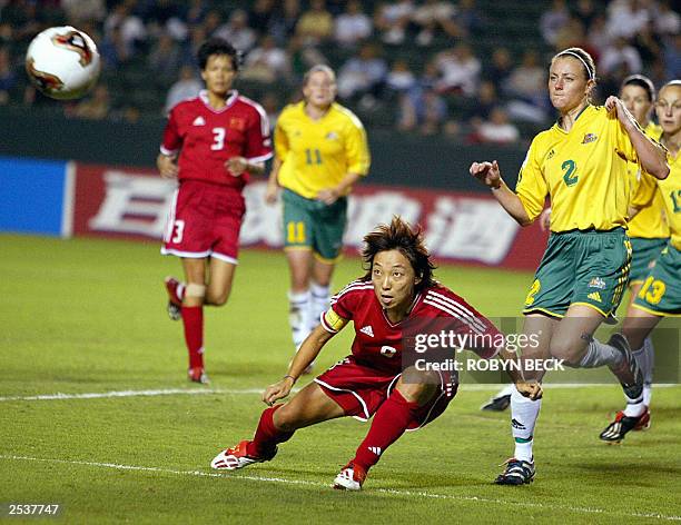 China's Sun Wen heads off a corner kick as Australia's Gillian Foster defends during their Group D soccer match in the 2003 FIFA World Cup in Carson,...