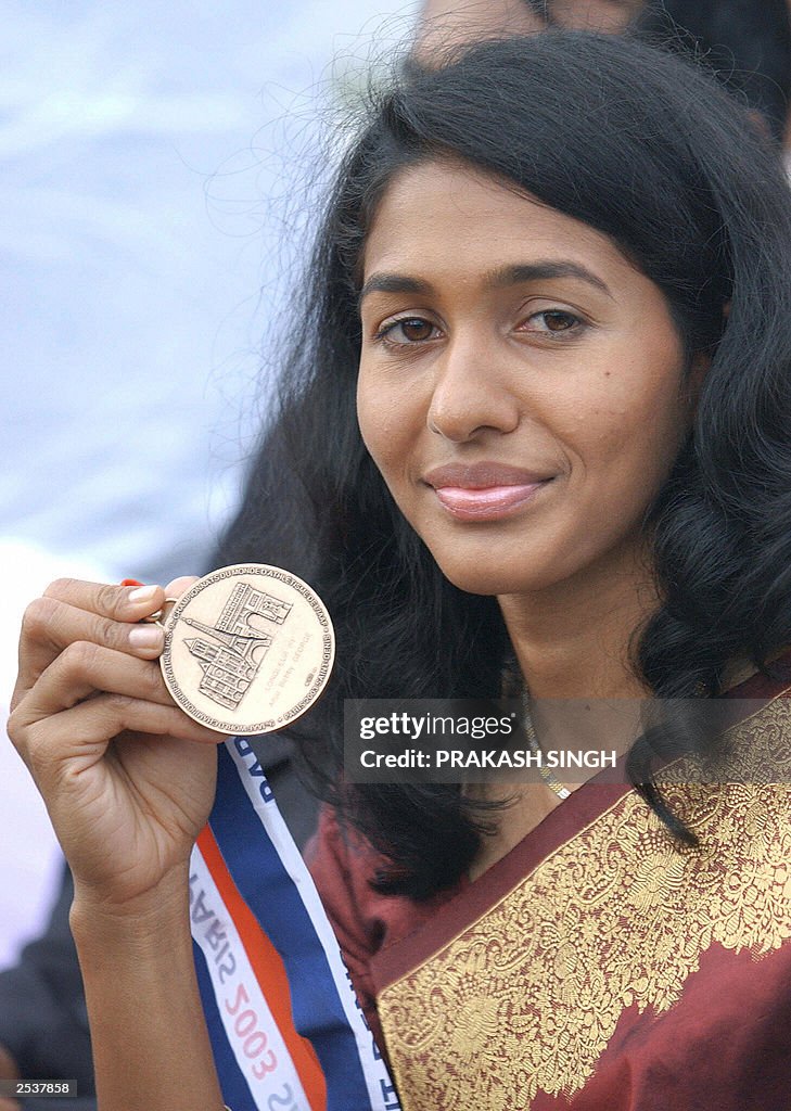 Indian long Jumper Anju George (R) poses