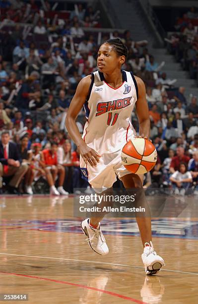 Kedra Holland-Corn of the Detroit Shock drives upcourt during game three of the 2003 WNBA Finals against the Los Angeles Sparks at the Palace of...