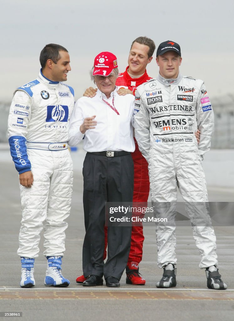 Michael Schumacher of Germany and Ferrari at a photo session with Kimi Raikonnen of Finland and McLaren and Juan Pablo Montoya of Columbia and Williams