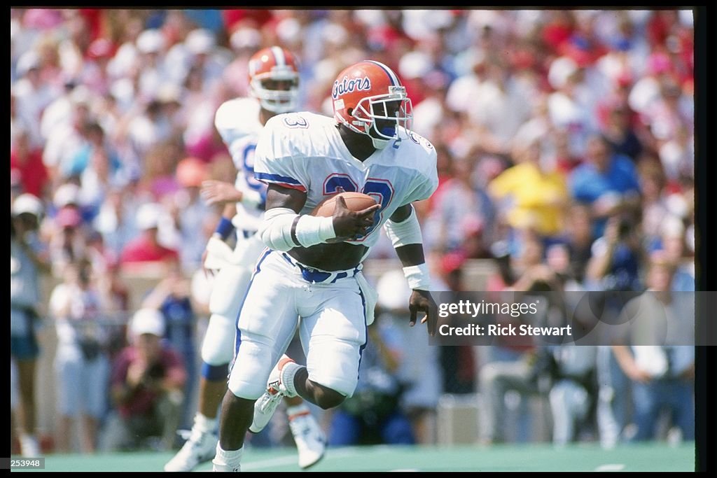 Ericht Rhett Running back Errict Rhett of the Florida Gators runs down the field ...