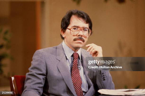 Former president of Nicaragua and leader of the Sandanista movement Daniel Ortega sits at a table, circa 1990.