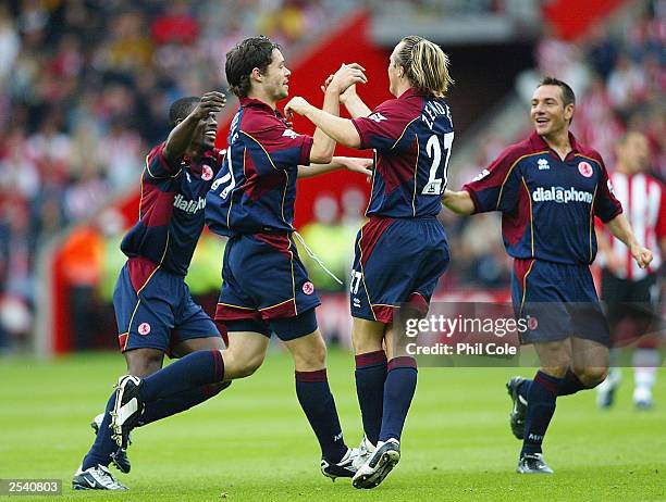 Malcolm Christie of Middlesbrough celebrates with his team-mates after scoring the first goal during the FA Barclaycard Premiership match between...