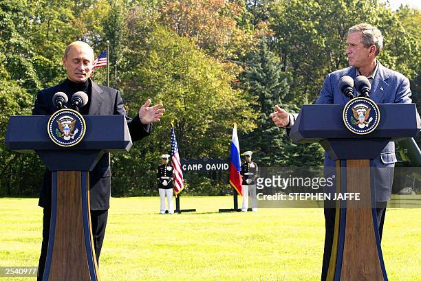 President George W. Bush and Russian President Vladimir Putin hold a joint press conference at Camp David 27 September 2003 in Maryland. Bush hosted...