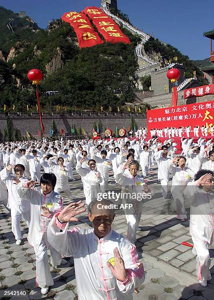 Thousands of Chinese Tai-chi martial arts exponents gather to show off their skills on the Great Wall of China at Juyongguan, on the outskirts of...