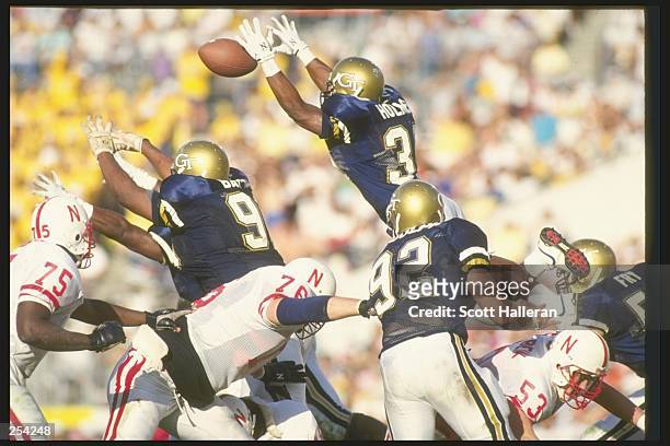 Keith Holmes of the Georgia Tech Yellow Jackets jump to block a field goal during the Citrus Bowl against the Nebraska Cornhuskers in Orlando,...