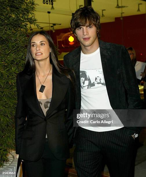 Actress Demi Moore and boyfriend actor Ashton Kutcher arrive for the opening of the Stella McCartney Store September 28, 2003 in Beverly Hills,...
