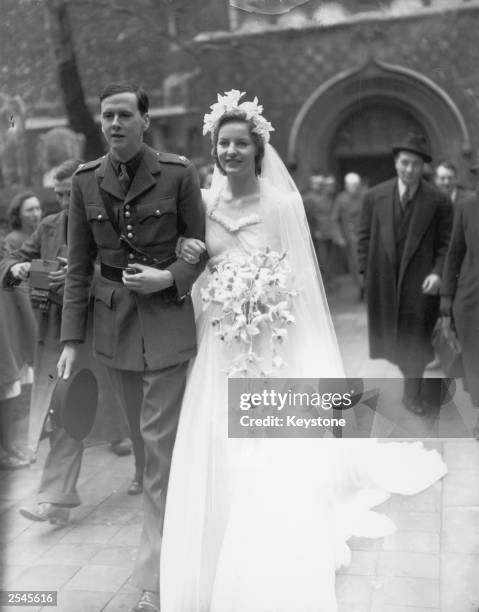 The Duke of Devonshire, Lord Andrew Cavendish and his wife Deborah Mitford after their wedding, 19th April 1941.