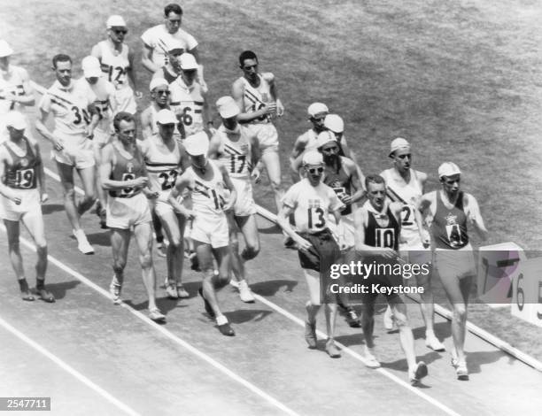 Norman Read of New Zealand leads the field during the 50 kilometre walk final at the Olympics, Melbourne, 29th November 1956. He finished with a 400...