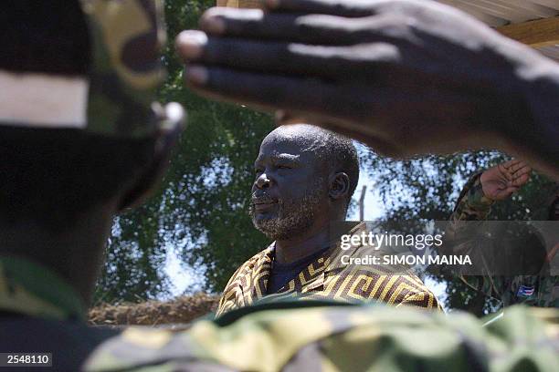 Sudanese Peoples Liberation Army leader Joghn Garang listens to the national anthem at freedom square in Rumbek 30 September 2003, during a rally...