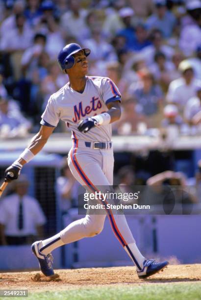 Darryl Strawberry of the New York Mets swings at the pitch during a game in the 1990 season. (Photo by: Stephen Dunn/Getty Images