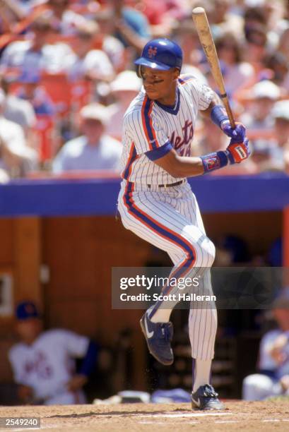 Darryl Strawberry of the New York Mets steps into the swing during a game in the 1990 season. (Photo by: Scott Halleran/Getty Images