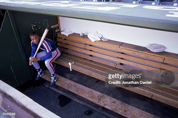 Darryl Strawberry of the New York Mets sits in the dugout during a game in the 1990 season. (Photo by: Jonathan Daniel/Getty Images