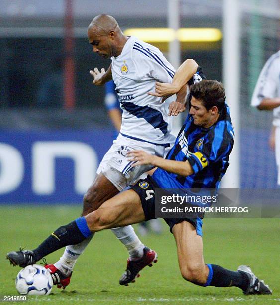 Inter's midfielder Javier Zanetti vies with Kiev's opponent Diogo Rincon, 30 September 2003, at San Siro stadium in Milan, during the first leg match...