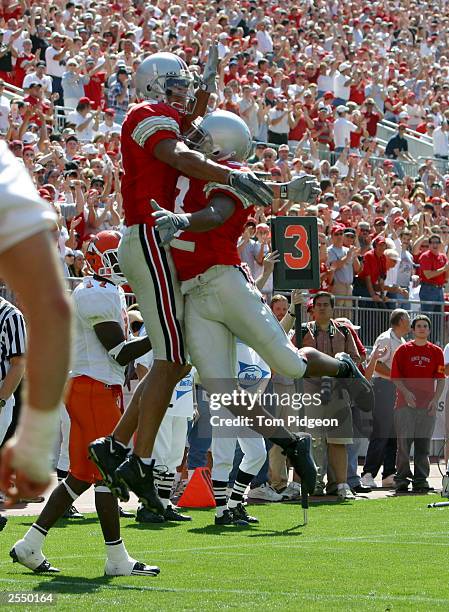 Split end Drew Carter of the Ohio State University Buckeyes celebrates with teammate Chris Gamble after catching a touchdown pass against the Bowling...