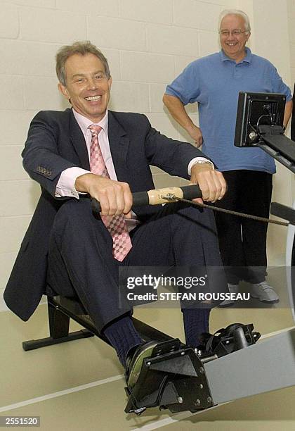 British Prime Minister Tony Blair is put through his paces on a rowing machine during a visit to the cardiac unit at the Royal Bournemouth Hospital...