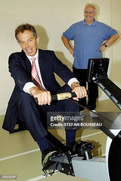 British Prime Minister Tony Blair is put through his paces on a rowing machine during a visit to the cardiac unit at the Royal Bournemouth Hospital...