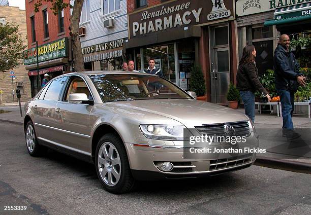 New 2004 Volkswagen Phaeton luxury sedan, not yet available in the U.S., is parked on a street for a print advertisement photo shoot October 1, 2003...