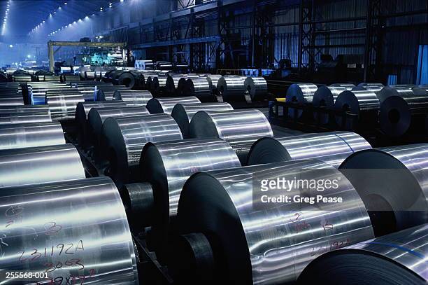 large rolls of sheet aluminium stored on factory floor - aluminium stock pictures, royalty-free photos & images