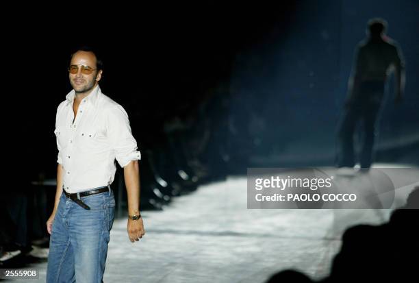 Fashion designer Tom Ford walks on the catwalk at the end of the Gucci collection during the Milan's 2004 Spring/Summer fashion week 02 October 2003....