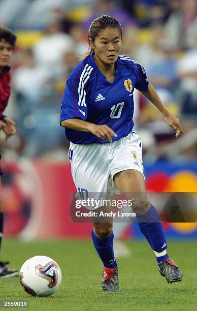 Forward Homare Sawa of Japan dribbles the ball against Germany during the FIFA Women's World Cup match at Crew Stadium on September 24, 2003 in...