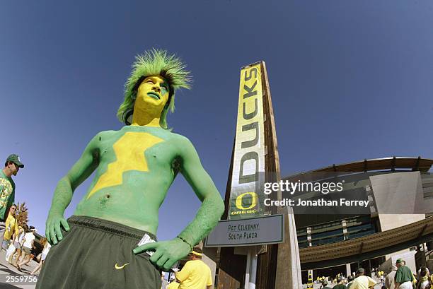 University of Oregon fan poses outside the Autzen stadium before the game against the Washington State University Cougars on September 27, 2003 in...