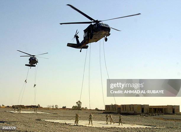 Troops from the 101st Airborne Division train at an air assault school in the airbase of Camp Qayyara, 35 kms south of Mosul, in nothern Iraq 04...