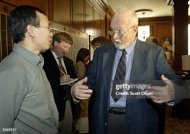 Paul Lauterbur , a professor at the University of Illinois, talks with one of his former students, Lhi-Pei Liang, following a media conference at the...